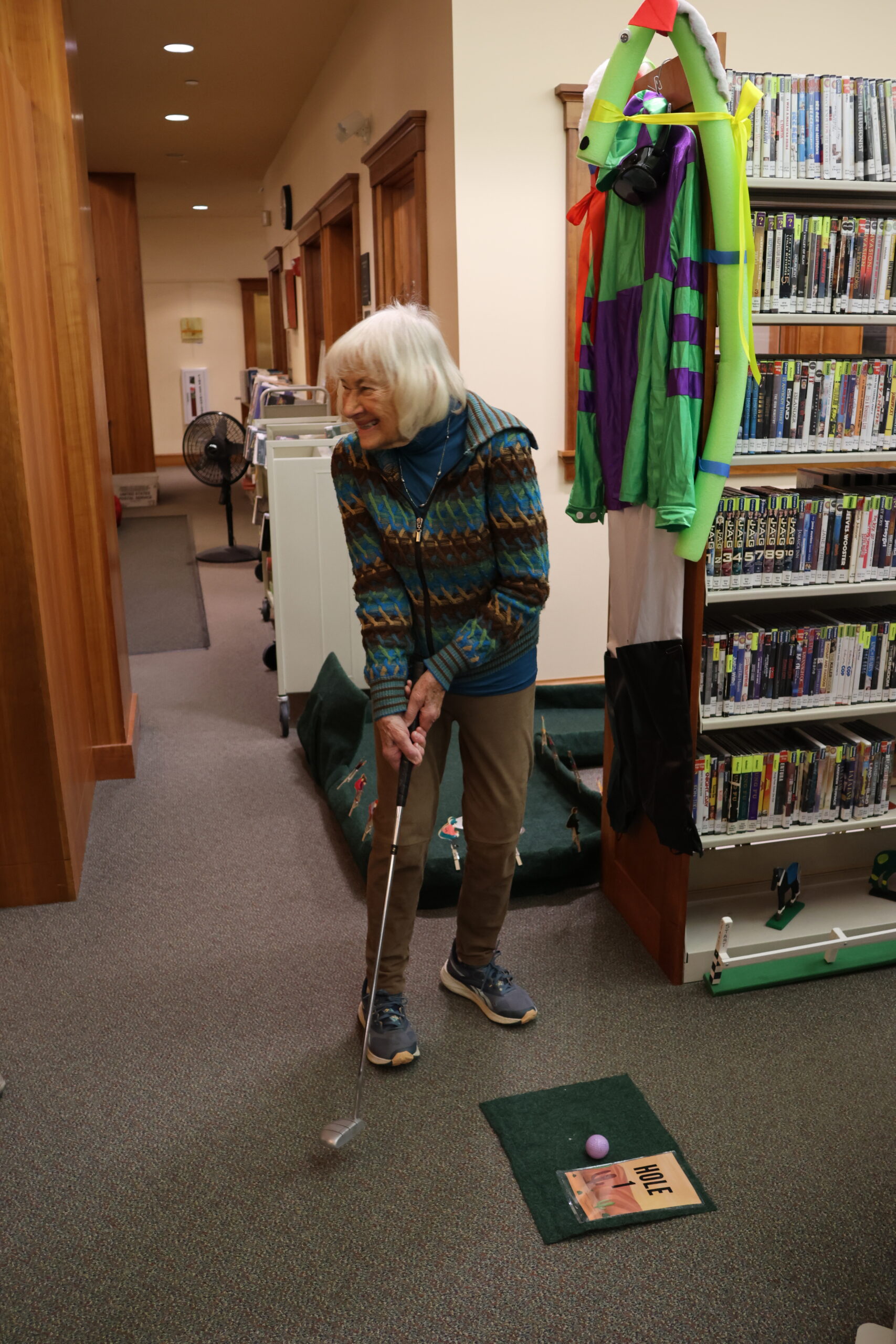 Carla Rolde tees off at Hole #1 at Mini-Golf at the Library 2025. </p>
<p>
