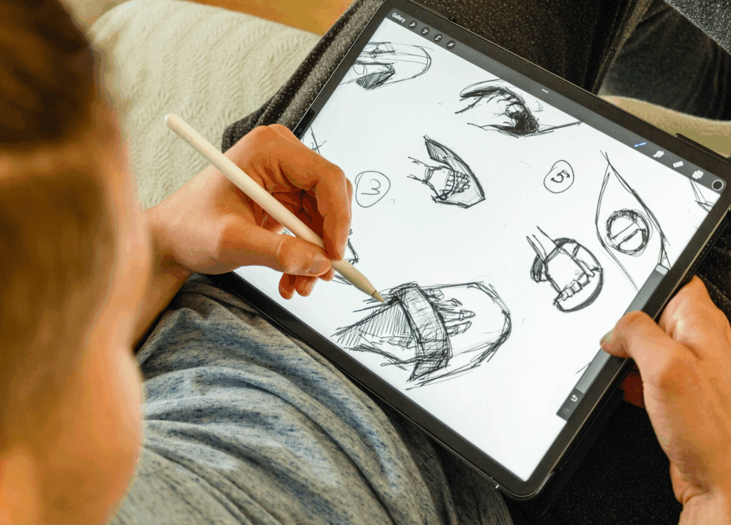 Person drawing on iPad